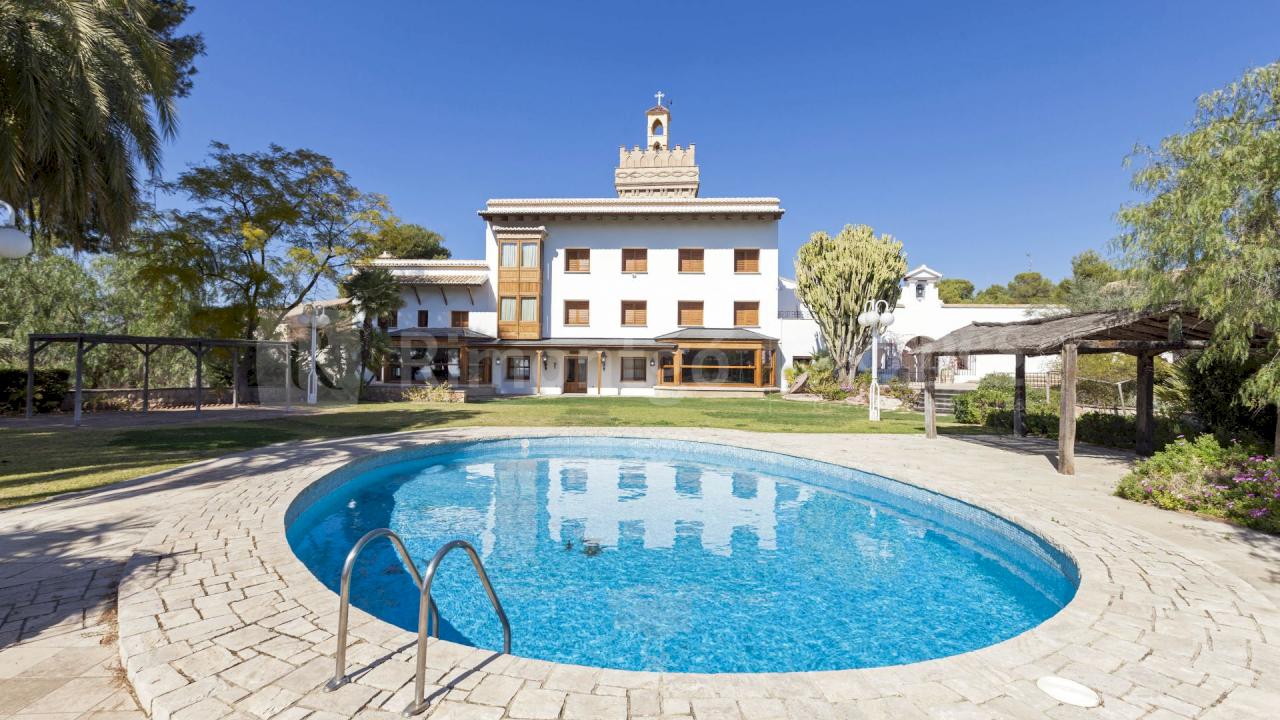 Historic property with a unique tower located less than 30km from the city of Valencia offering crops and an olive press.